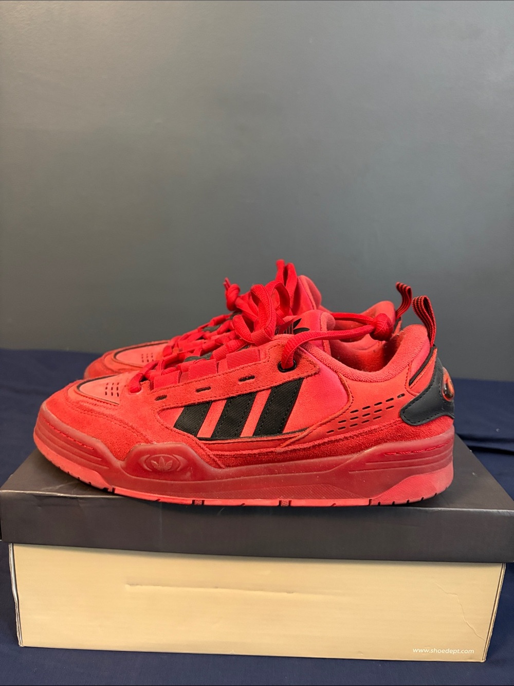 adidas Red Low-Top Sneakers with Black Stripes